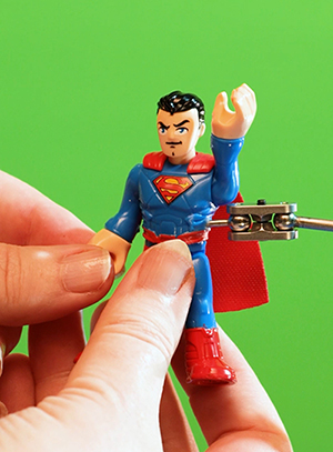 Superman toy on stop motion rig